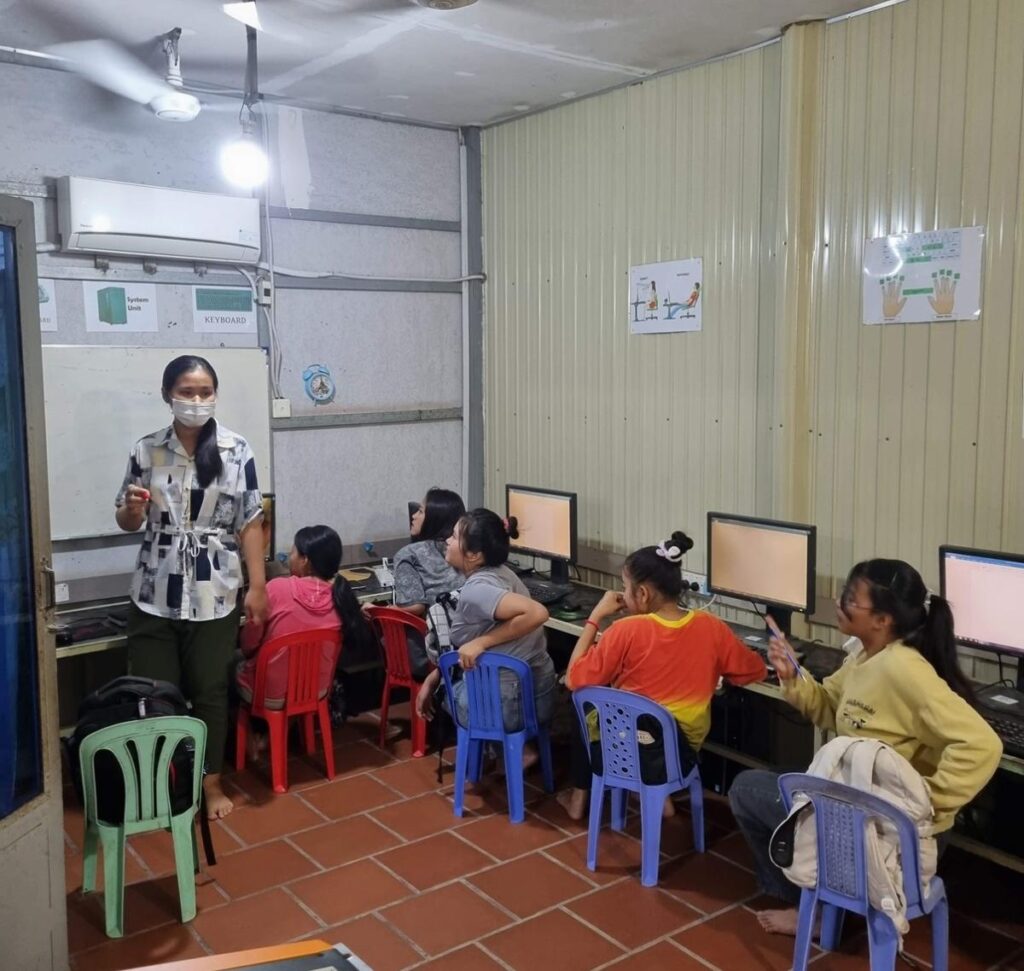 Students learning at computers in the DCC computer room