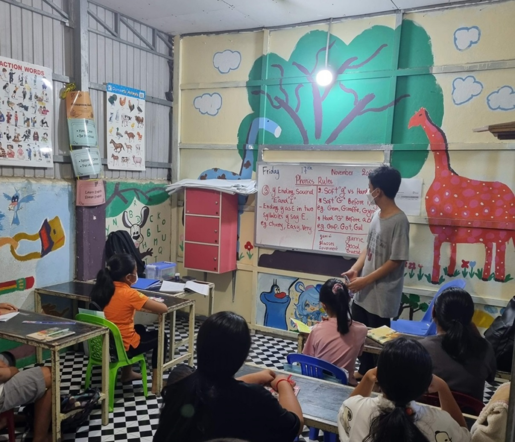 A DCC English class in a brightly painted classroom