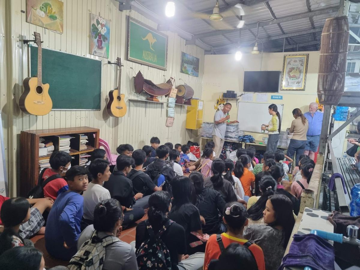 DCC students gathered in a classroom for an assembly