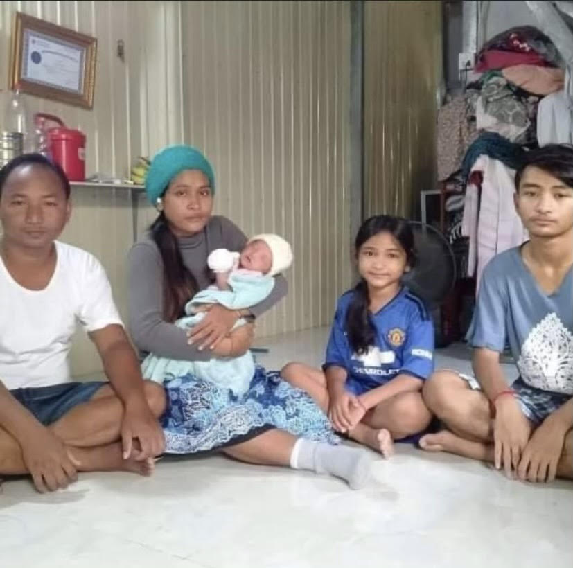 Bophal and Chantrea with their three children at home